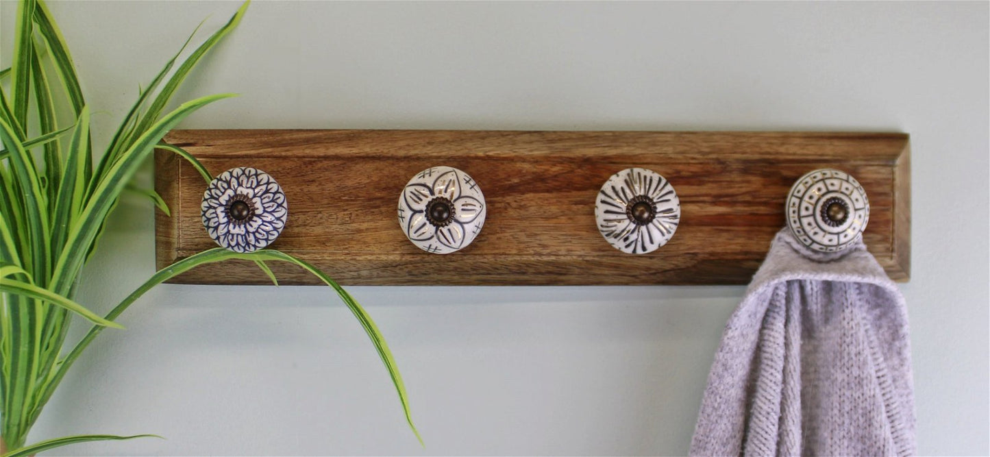 4 Single Ceramic Ivory Coat Hooks On Wooden Base